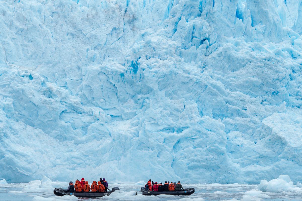 Guests explore zodiacs on tour at the Garibaldi Glacier in Albert de Agostini National Park in the Cordillera Darwin mountain range, Chile.