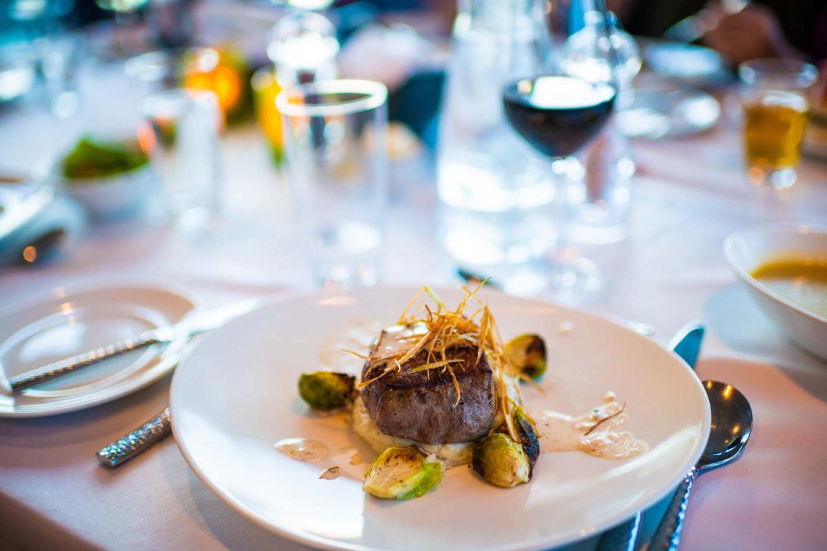 A plate of steak dinner aboard the ship National Geographic Quest