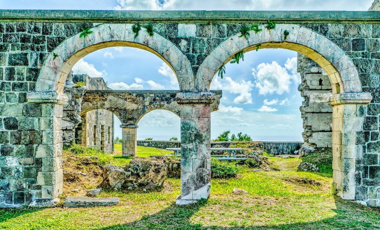 Brimstone Hill Fortress National Park is a UNESCO World Heritage Site, a well-preserved fortress on a hill on the island of St. Kitts in the Federation of St. Christopher (St. Kitts) and Nevis.