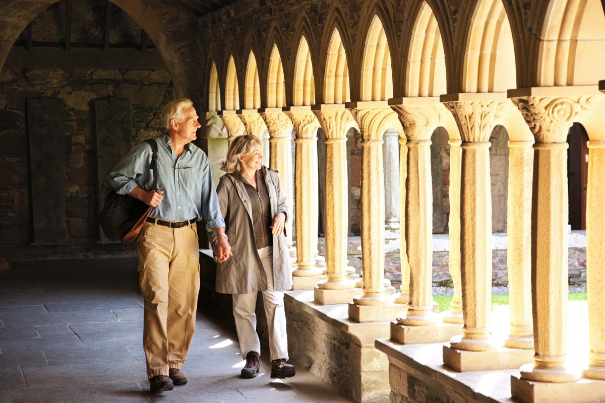 Guests explore Iona Abbey where Macbeth’s body lies in an unmarked grave in Iona,Scotland.