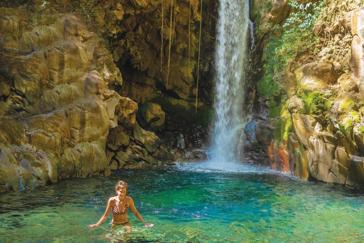 A guest swims at Guachipelin National Park, in Guanacaste, Costa Rica