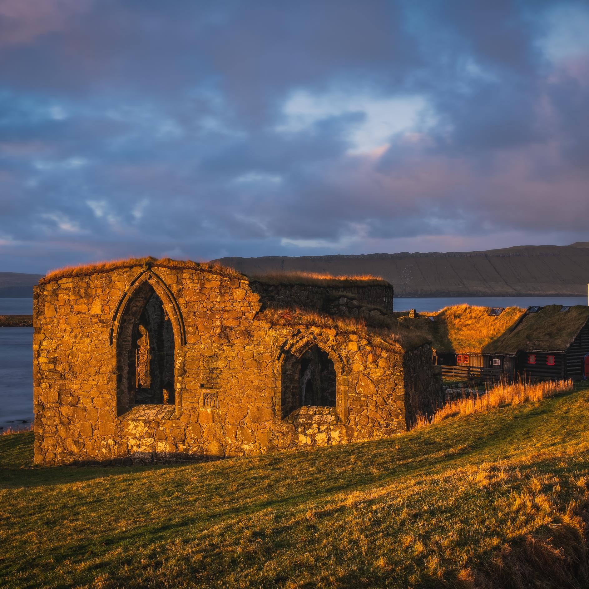 The ruins of St. Magnus Cathedral in Kirkjubour Kirkebo a historical village on Streymoy, Faroe Islands. The ruins are the largest medieval building in the Faroe Islands, Denmark