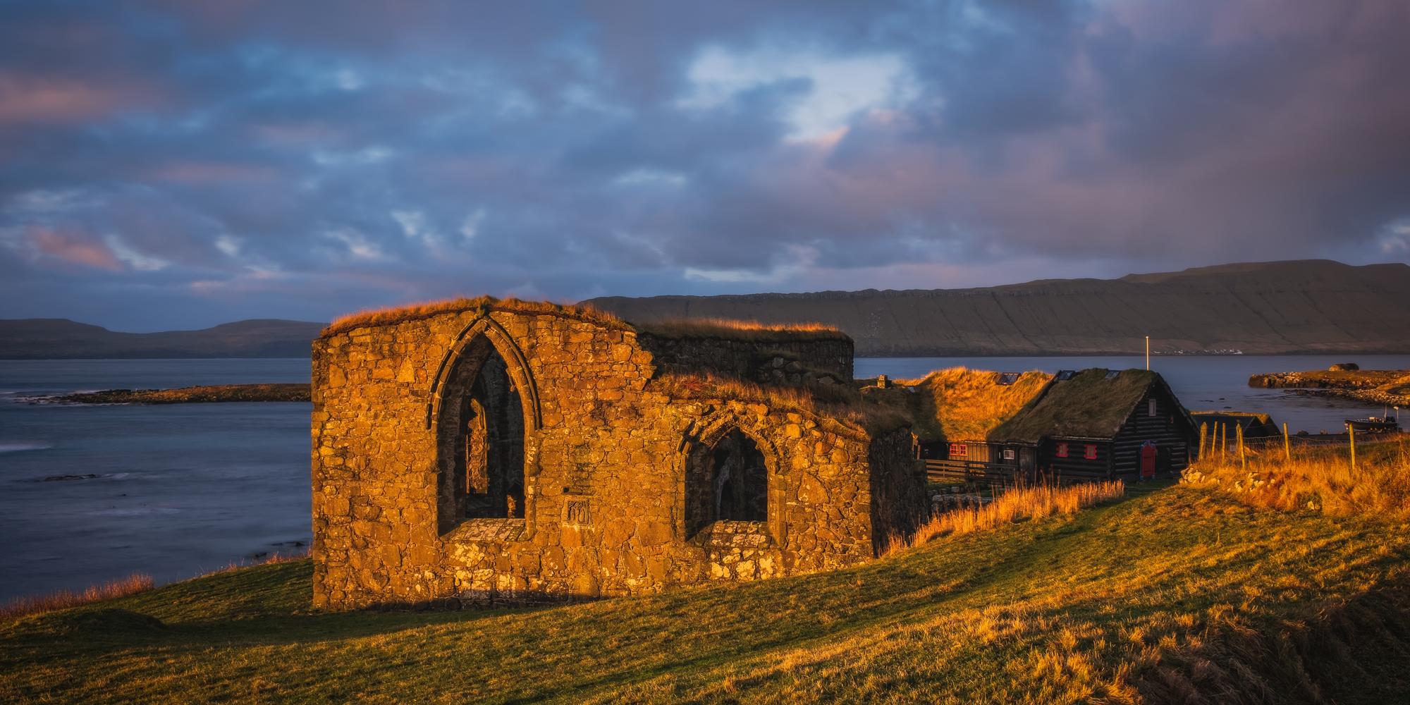 The ruins of St. Magnus Cathedral in Kirkjubour Kirkebo a historical village on Streymoy, Faroe Islands. The ruins are the largest medieval building in the Faroe Islands, Denmark