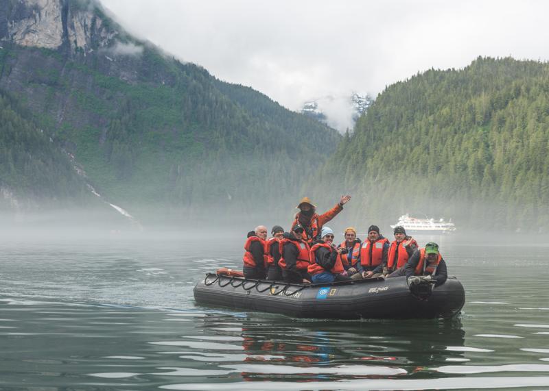 Lindblad Naturalist, Jeff Litton, leads a zodiac cruise in Owl Pass in Rudyerd Bay, Misty Fiords National Monument, Ketchikan, Alaska, USA.