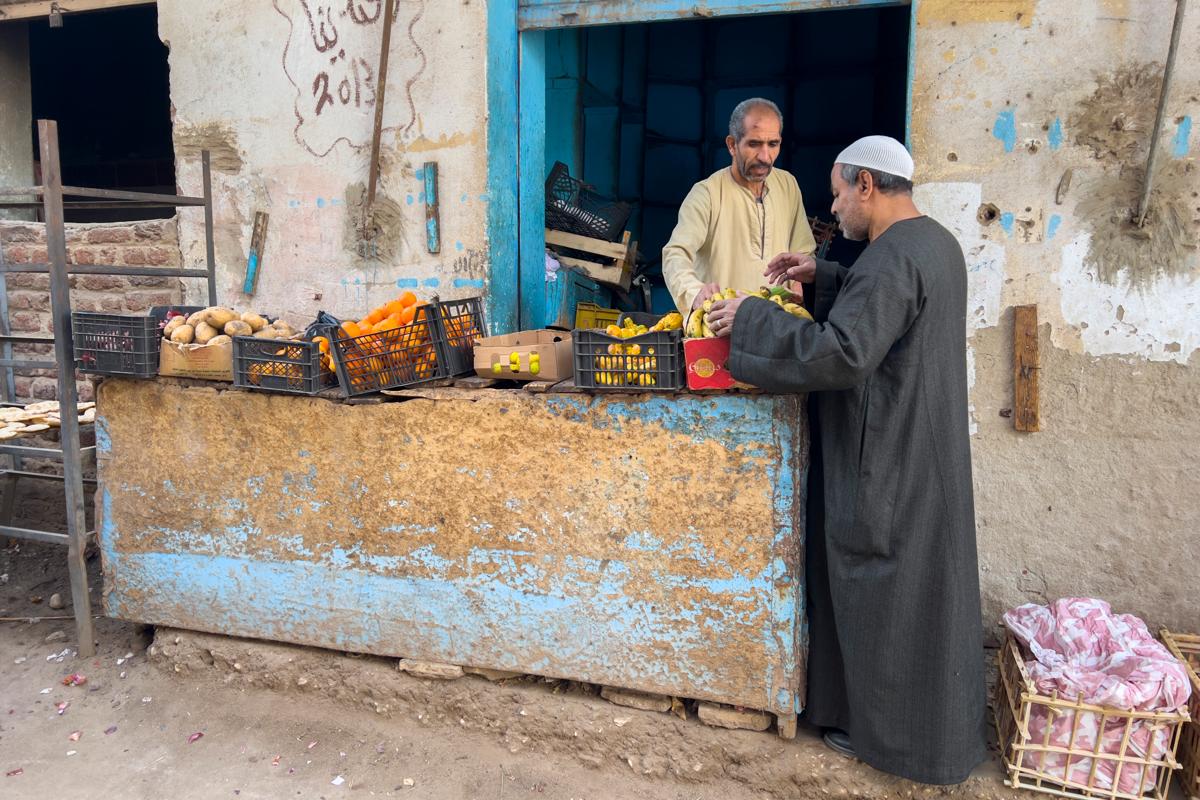 Egyptian street vendors near the Temple of Khnum, lying beneath the contemporary town of Esna, Egypt.