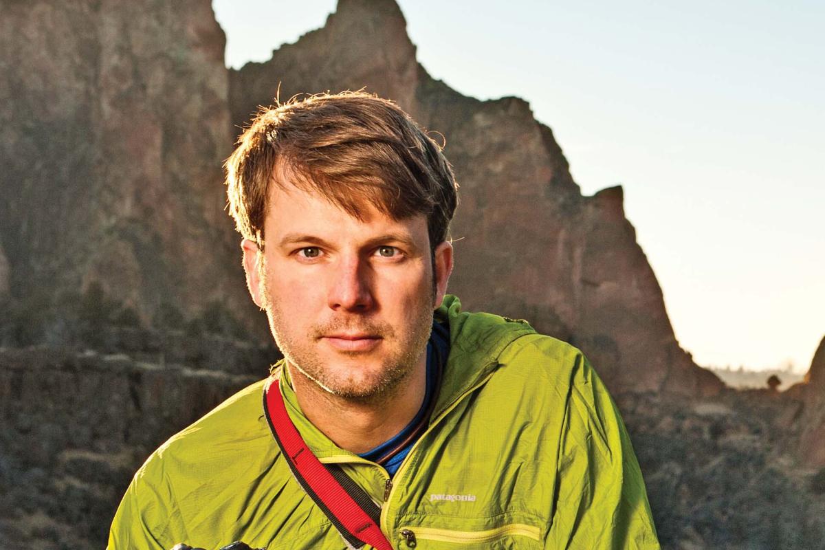 Jonathan Kingston, National Geogrphic Photography Expert, with climbing gear and camera at Smith Rock State Park, Oregon