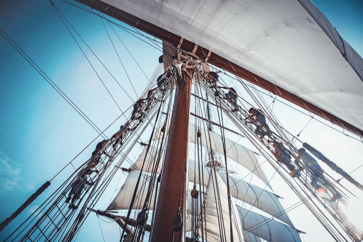 Deck crew up in the mast aboard the ship Sea Cloud