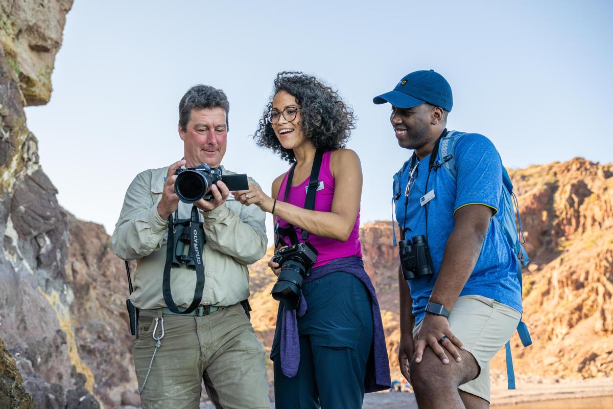 Photo instructor, Rich Reid, with Guests teaching them how to take better photos with a DSLR camera, Isla del Carmen, Gulf of California, Mexico