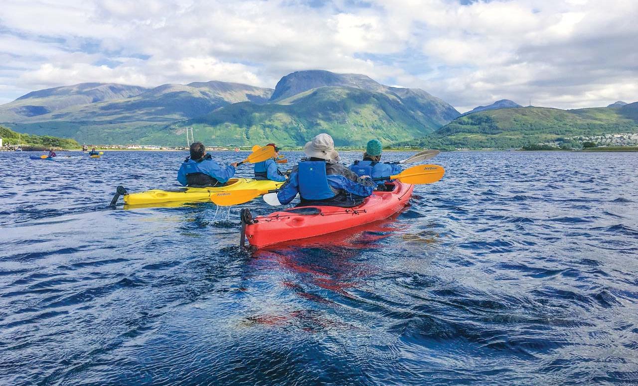 Guests explore by kayak in Scotland.