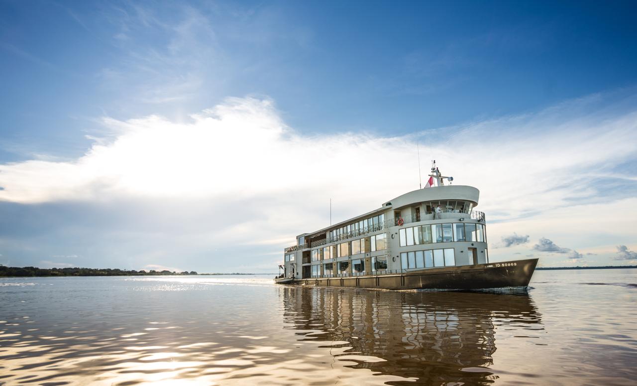 A daytime exterior view of the ship Delfin III.