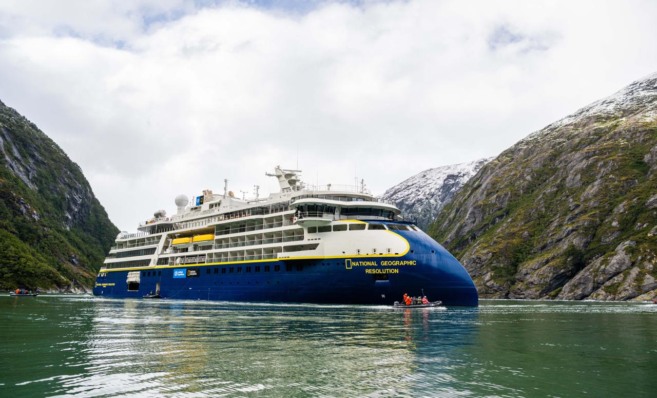 Guests explore by zodiac from the ship National Geographic Resolution against the picturesque backdrop of the Beagle Channel, Tierra del Fuego, Chile.
