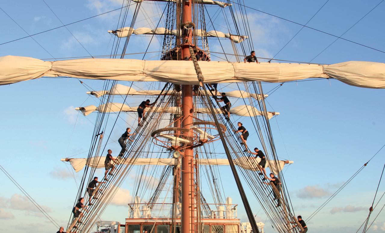 Sailing crew working on the ship Sea Cloud II.