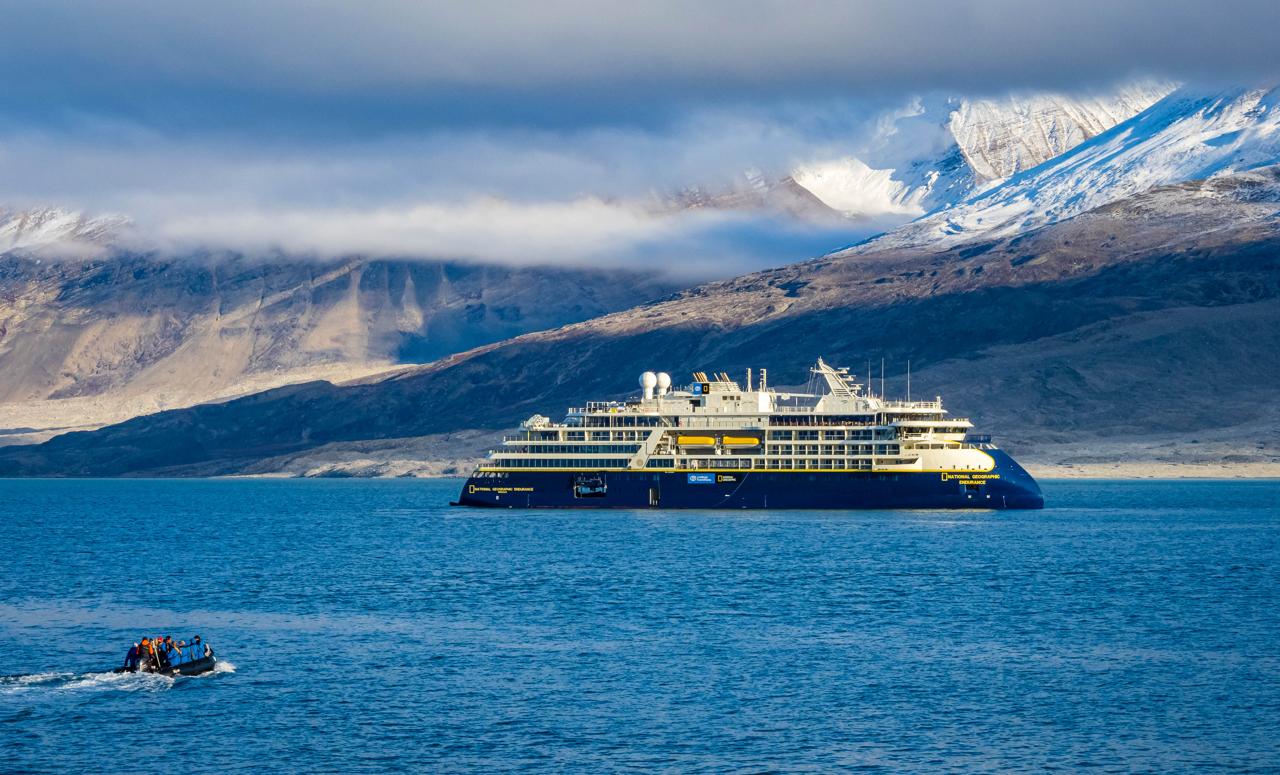 Guests exploring by Zodiac returning to the ship National Geographic Explorer, Alpejord Fjord, Northeast Greenland National Park, Greenland